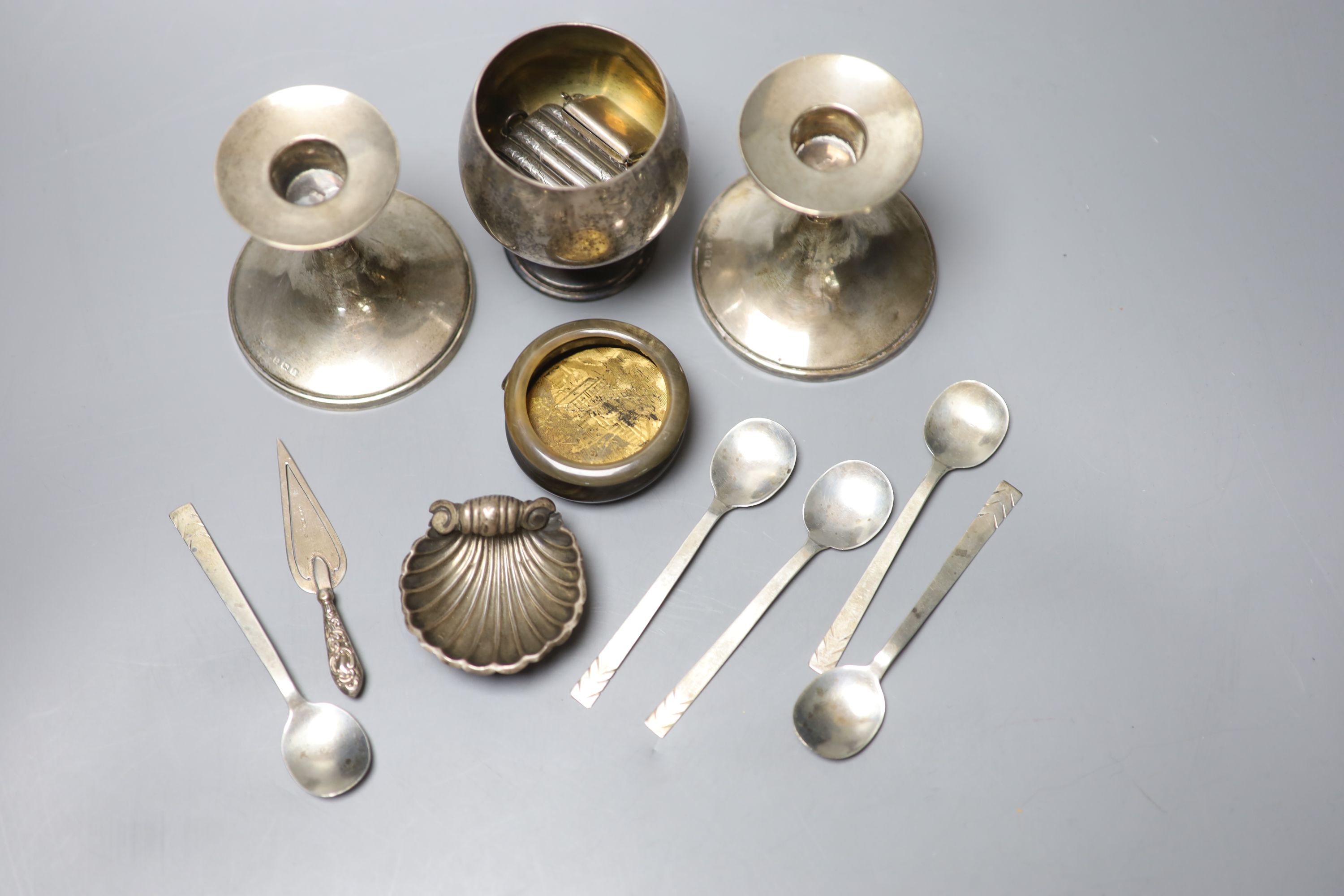 A group of small silver including dwarf candlesticks, coffee spoons, vesta, goblet, bookmark etc. and a horn box.